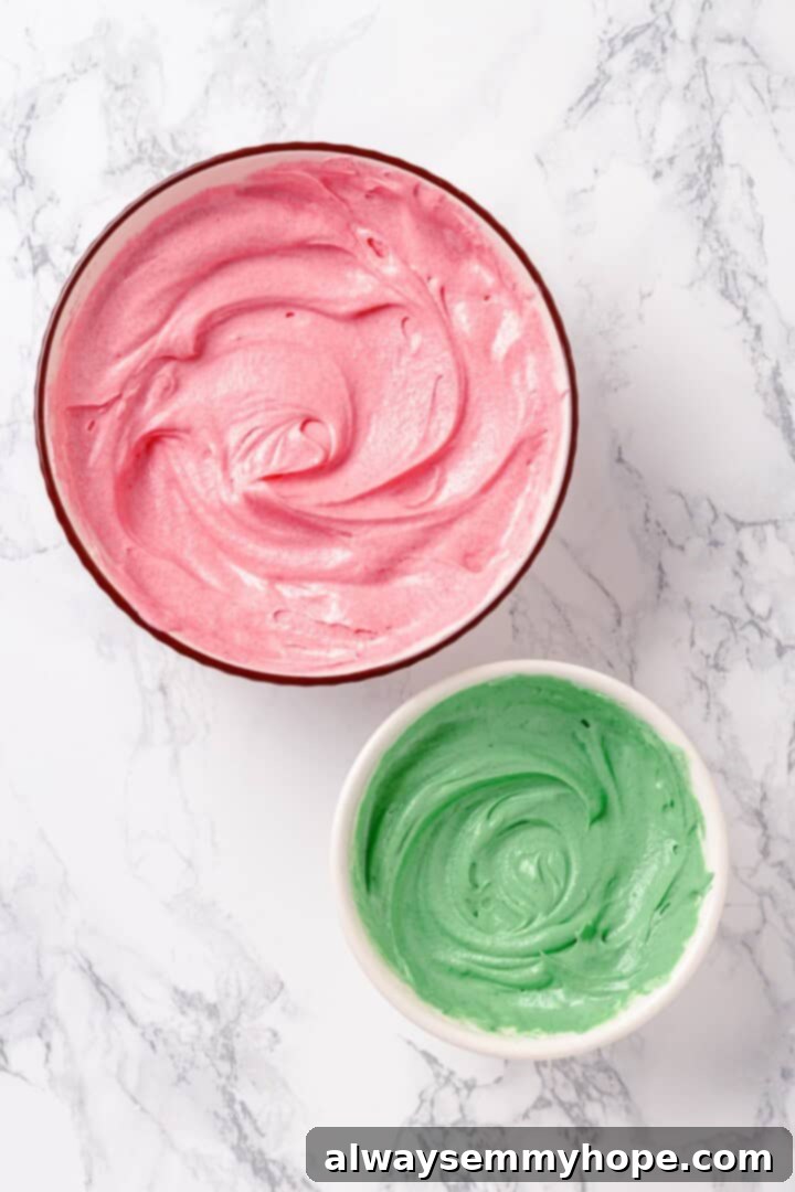 A bowl of green frosting and a separate bowl of pink frosting, prepared for decorating the Harry Potter cake.