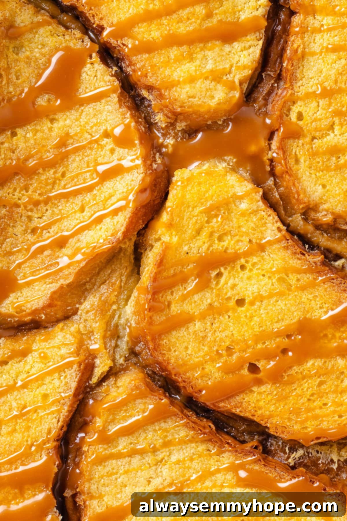 With a rich vegan custard and caramel, this Creme Brûlée French Toast has the flavour of the classic dessert in crowd-pleasing breakfast form! Closeup of creme brulee French toast casserole with caramel drizzle.