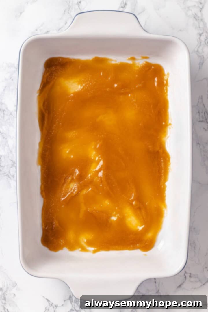 With a rich vegan custard and caramel, this Creme Brûlée French Toast has the flavour of the classic dessert in crowd-pleasing breakfast form! Caramel spread in bottom of baking dish.