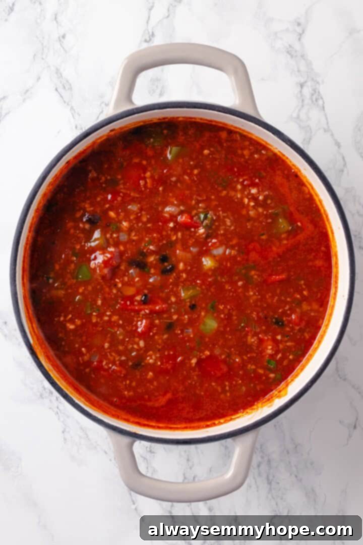 Stuffed pepper soup in Dutch oven before adding rice.