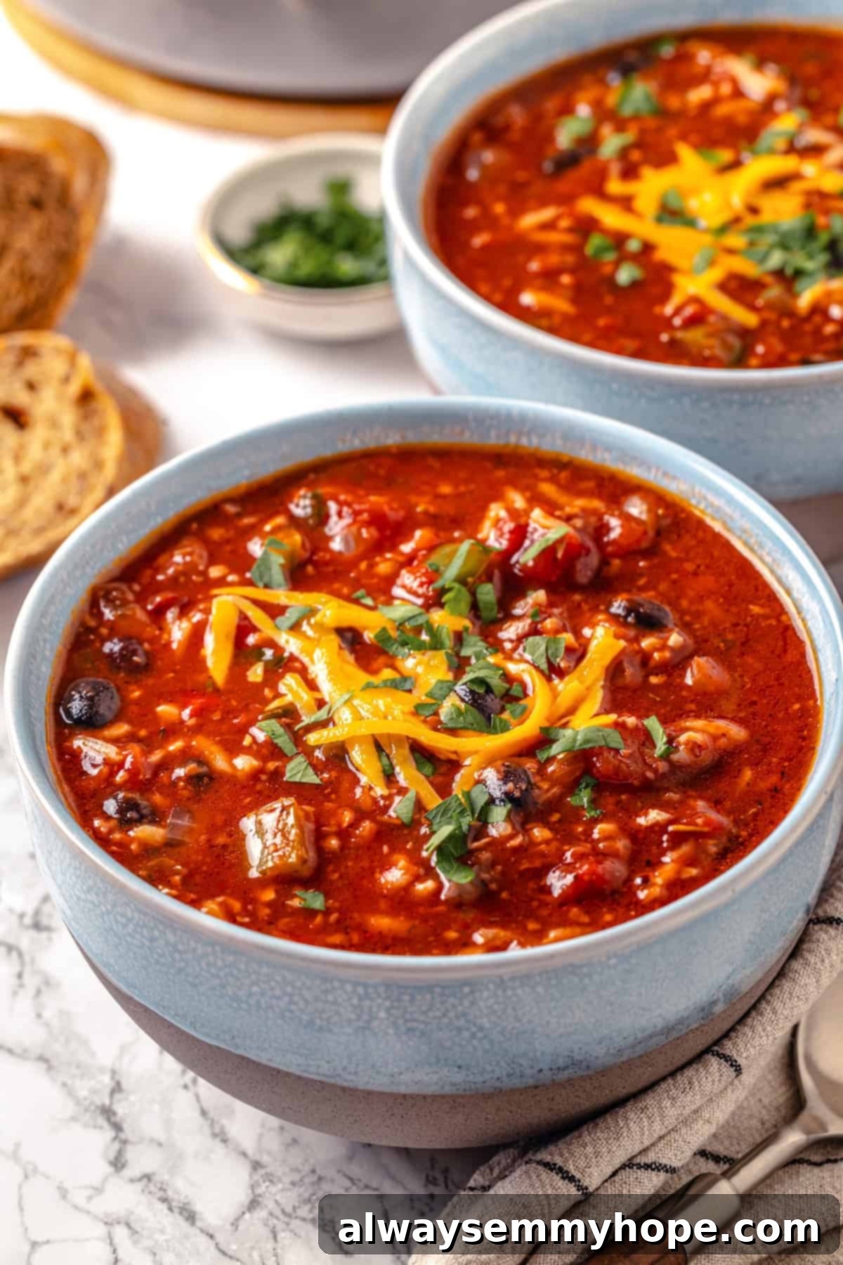 Two bowls of vegan stuffed pepper soup.