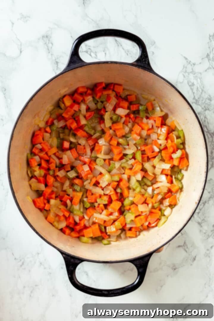 Softened carrot, celery, and onion in a Dutch oven.