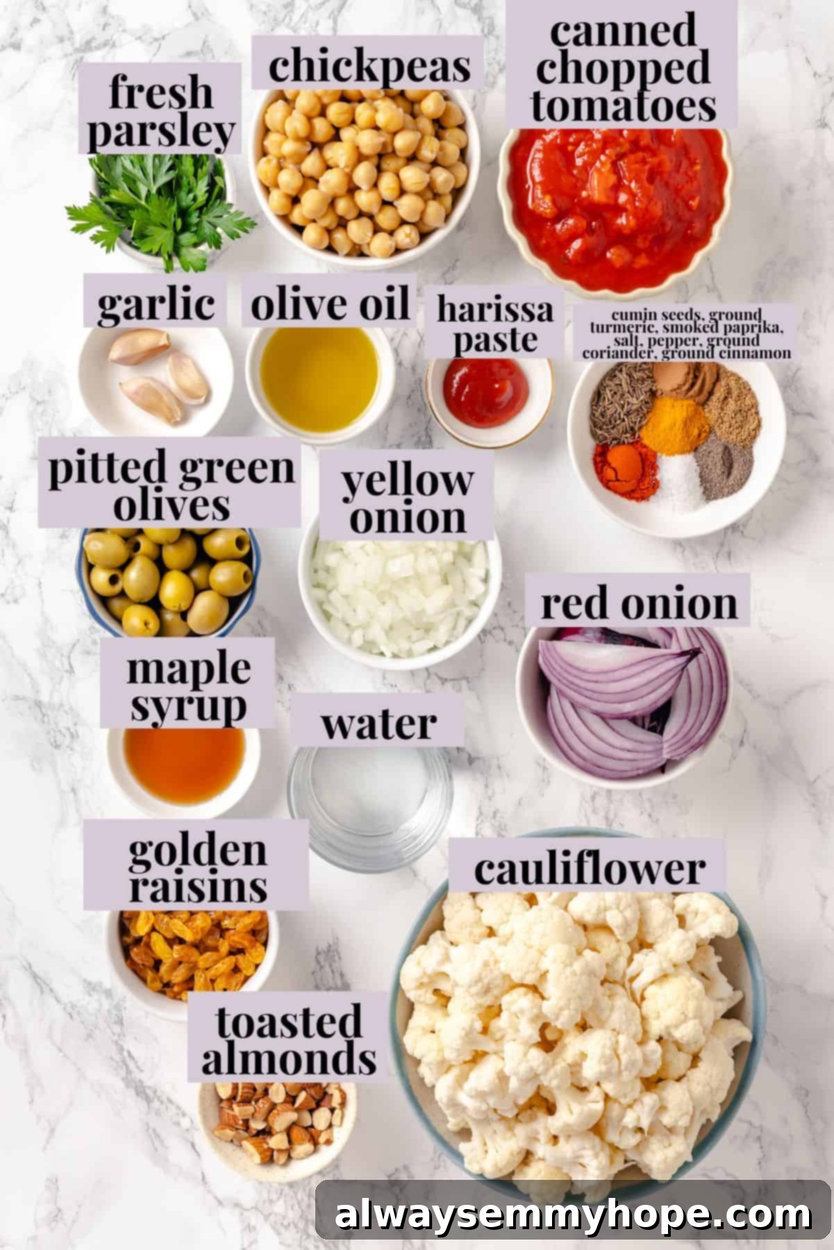 Warm spices mingle with vegetables, golden raisins, olives and chickpeas to make this Moroccan Cauliflower Tagine a delicious vegan dinner! Ingredients for Moroccan cauliflower tagine with labels