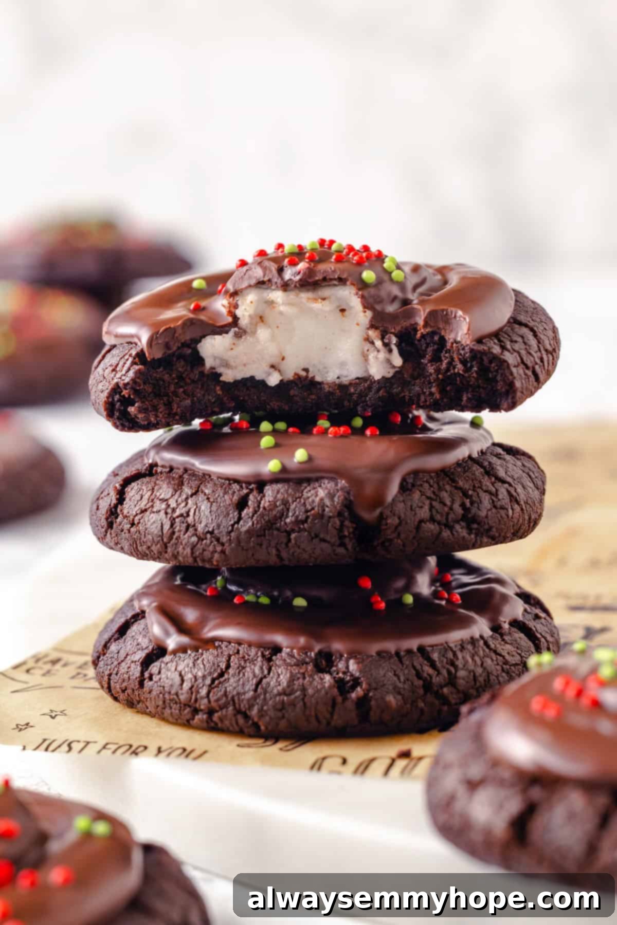 Stack of vegan hot chocolate cookies with a bite taken out.