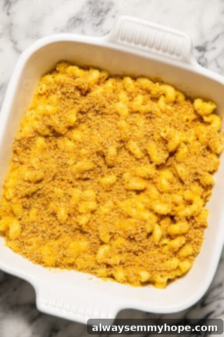Vegan Butternut Squash Mac and Cheese 12 Butternut squash mac and cheese in a baking dish with breadcrumbs sprinkled on top.