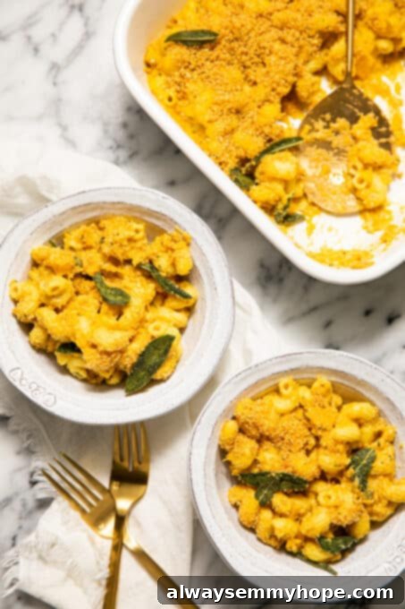 Vegan Butternut Squash Mac and Cheese 19 Two bowls of creamy butternut squash macaroni and cheese, garnished with fresh sage.