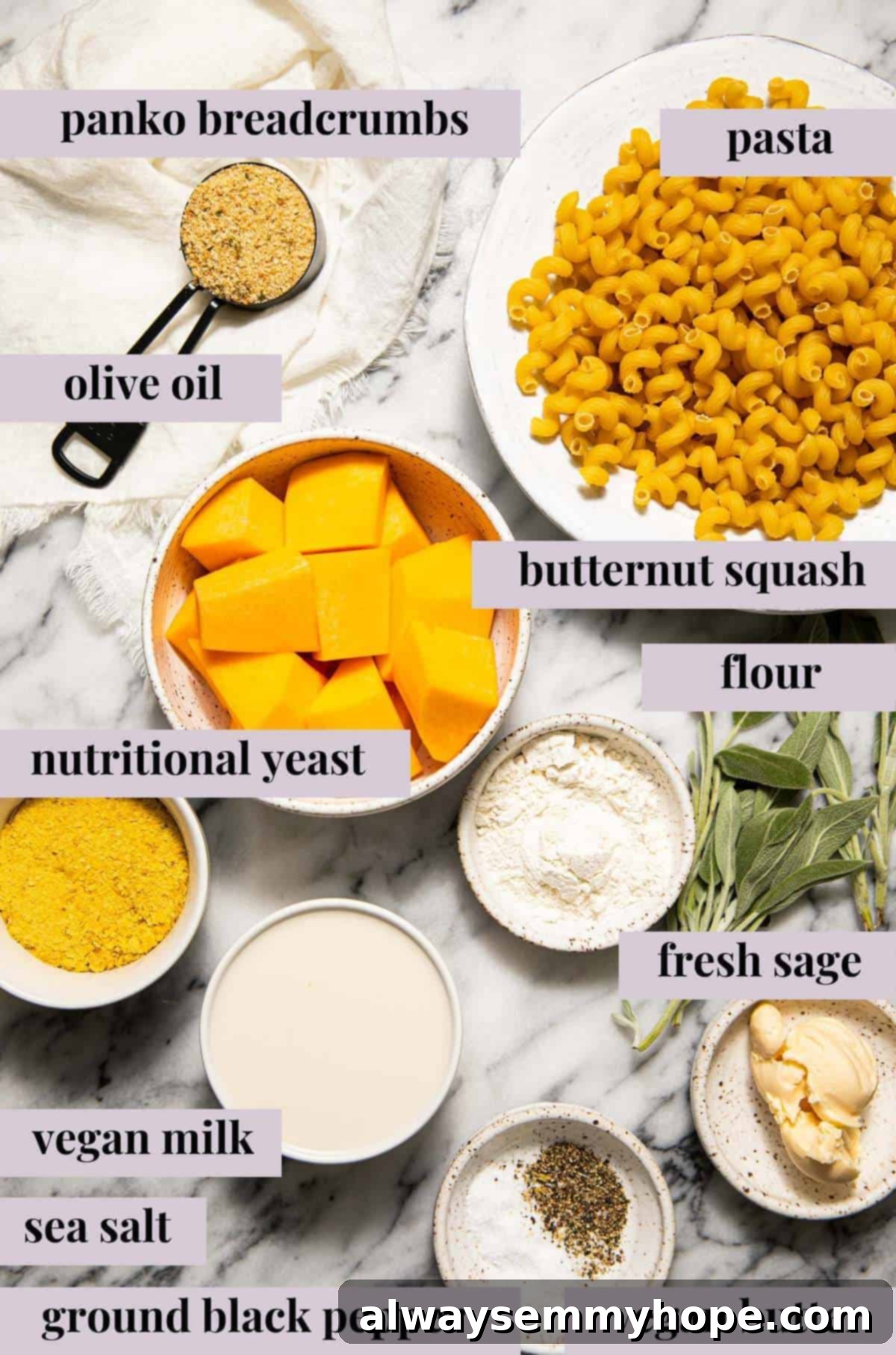 Vegan Butternut Squash Mac and Cheese 3 Close-up of fresh ingredients for vegan butternut squash mac and cheese, including chopped squash, sage, and pasta.