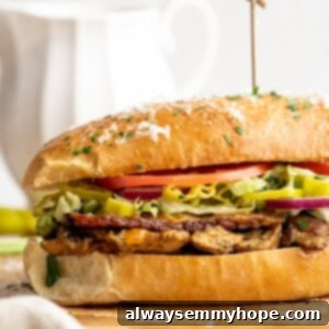 Vegan grinder sandwich on wooden board.