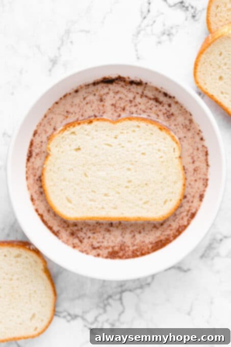 Piece of bread in the milk mixture.