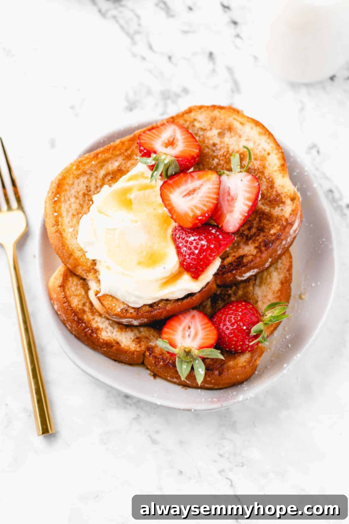 Plate of vegan french toast with strawberries.