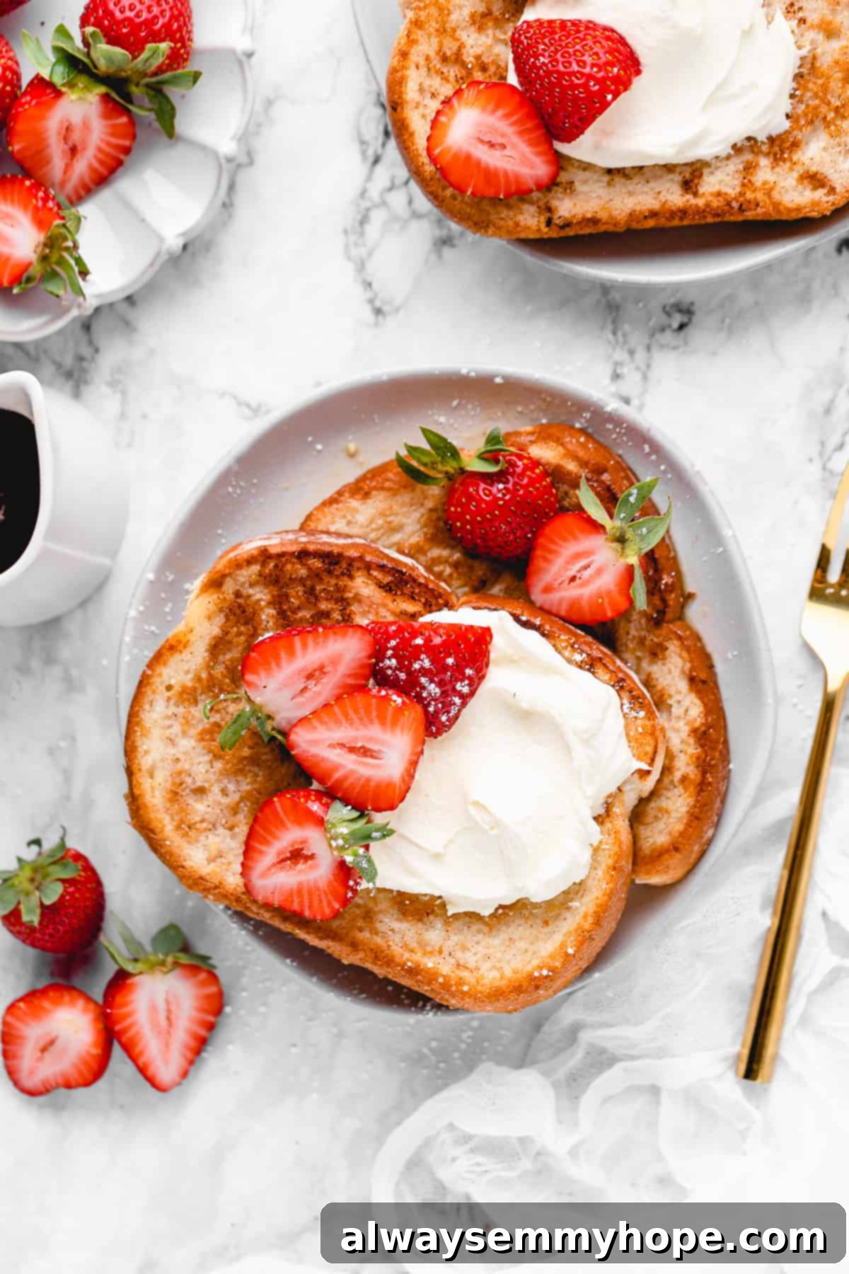 2 slices of french toast with strawberries.