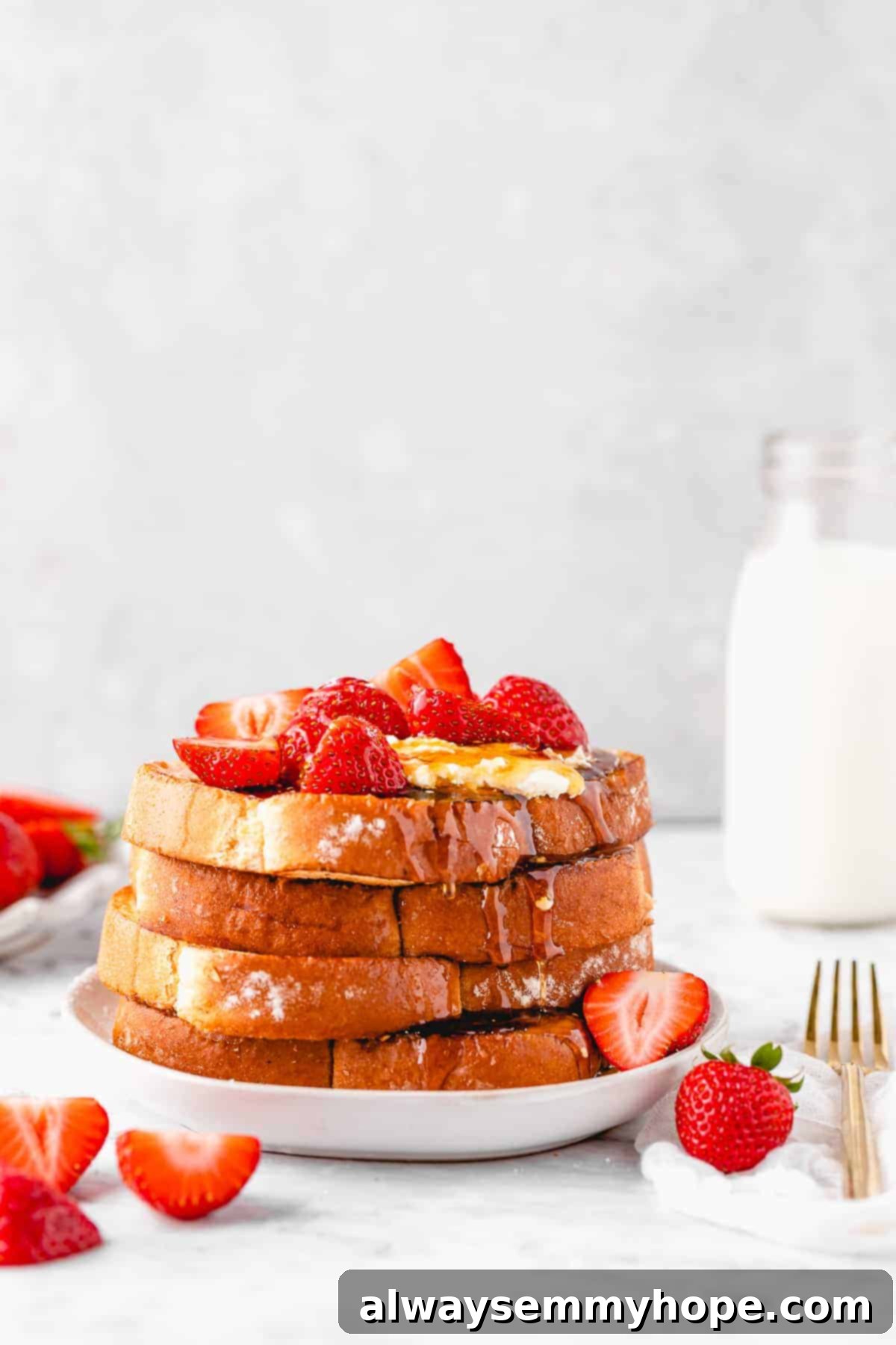 French toast stacked on a plate.