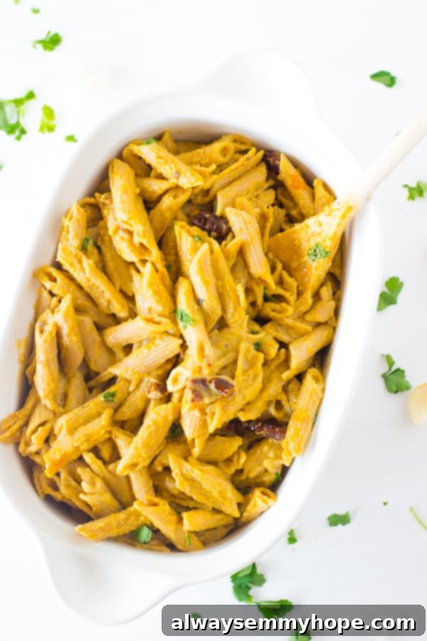 Creamy One-Pot Penne Alfredo 4 Alfredo penne pasta in a white baking dish, ready to be served.