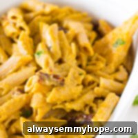 Creamy One-Pot Penne Alfredo 7 Overhead shot of penne pasta in a white baking dish