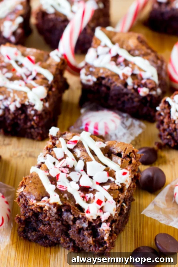A batch of peppermint chocolate brownies on a wooden table. 