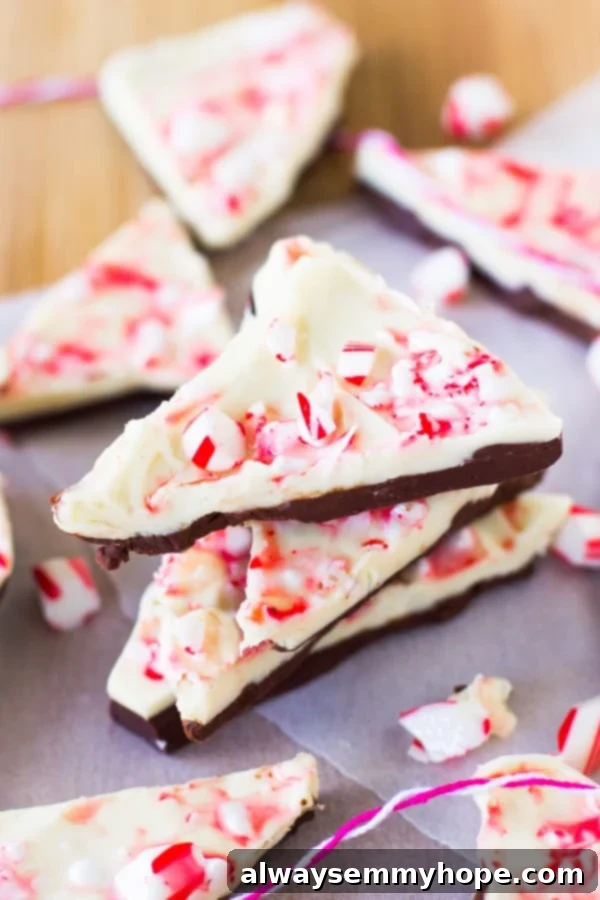 A stack of white chocolate peppermint bark on parchment.