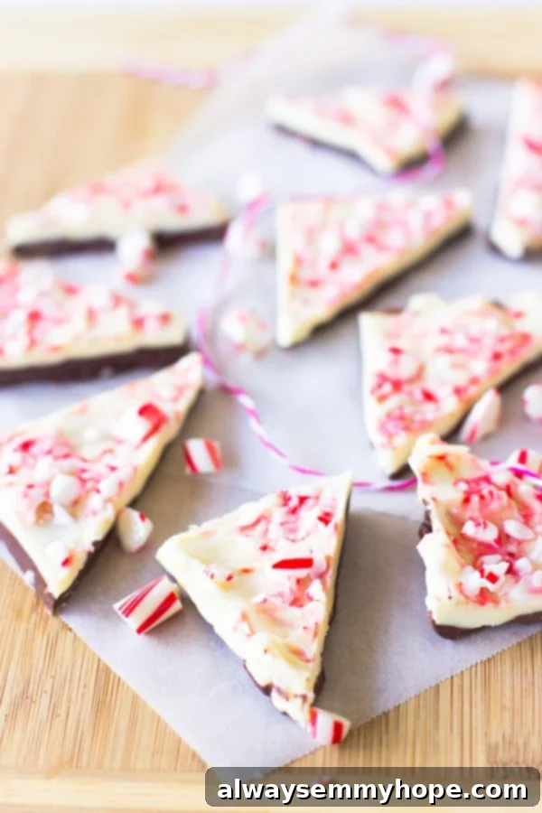 White Chocolate Peppermint Bark pieces on parchment. 