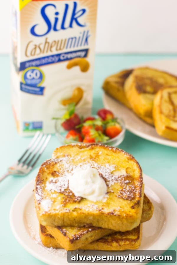 Eggnog French Toast 3 A pile of eggnog french toast on a white plate.