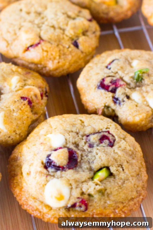 White Chocolate Cranberry Pistachio Gluten Free Cookies 4 Overhead shot of freshly baked white chocolate cranberry pistachio cookies on a wire rack.