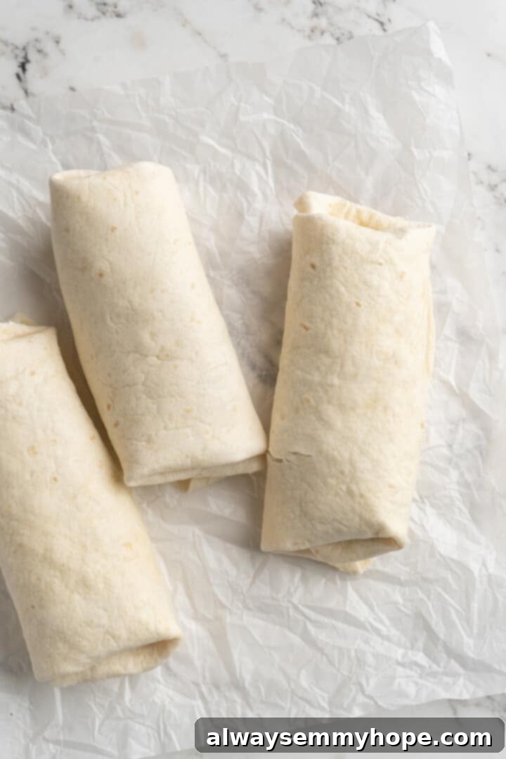 Overhead view of wrapped vegan breakfast burritos