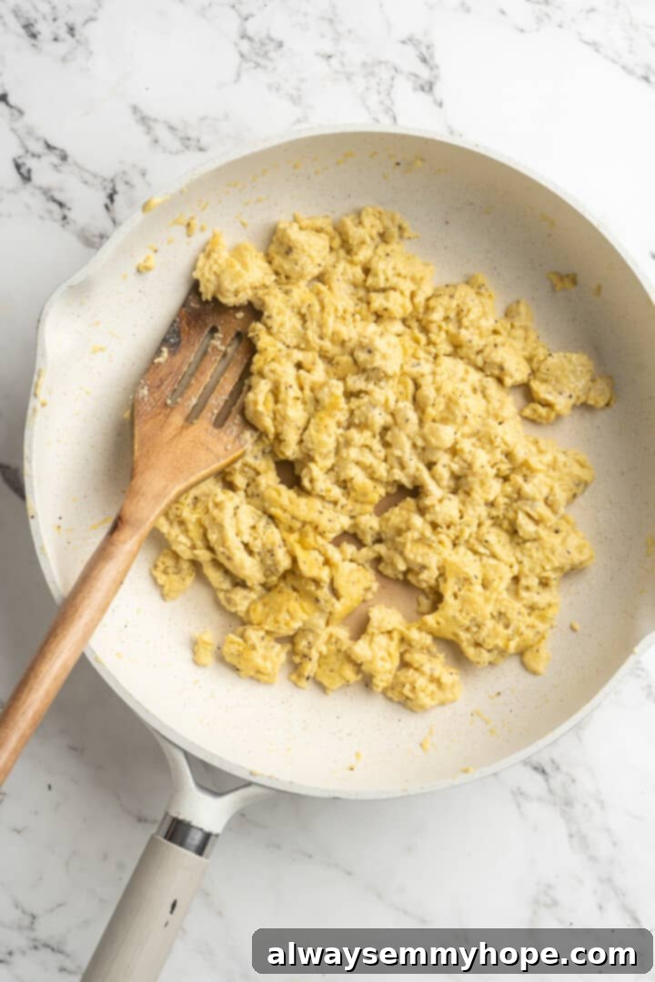Overhead view of vegan egg scramble being cooked in a skillet