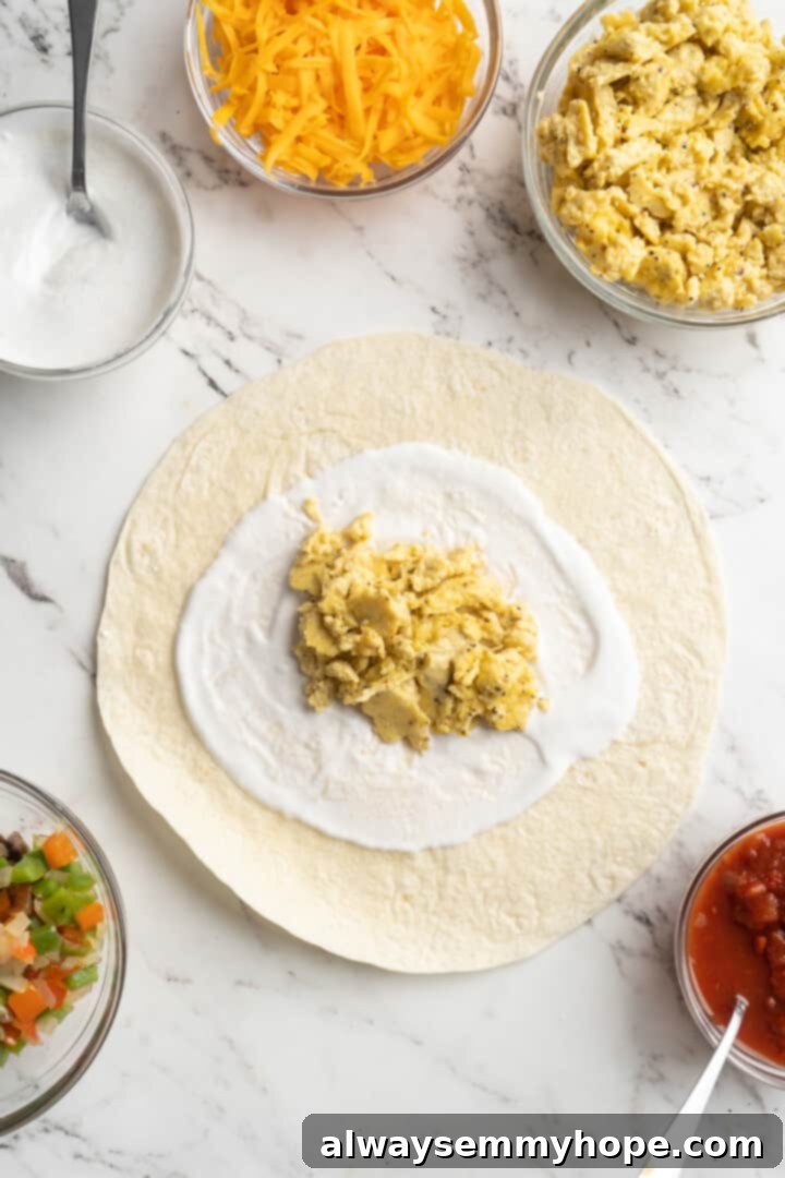 Overhead view of a tortilla topped with vegan yogurt and vegan scramble