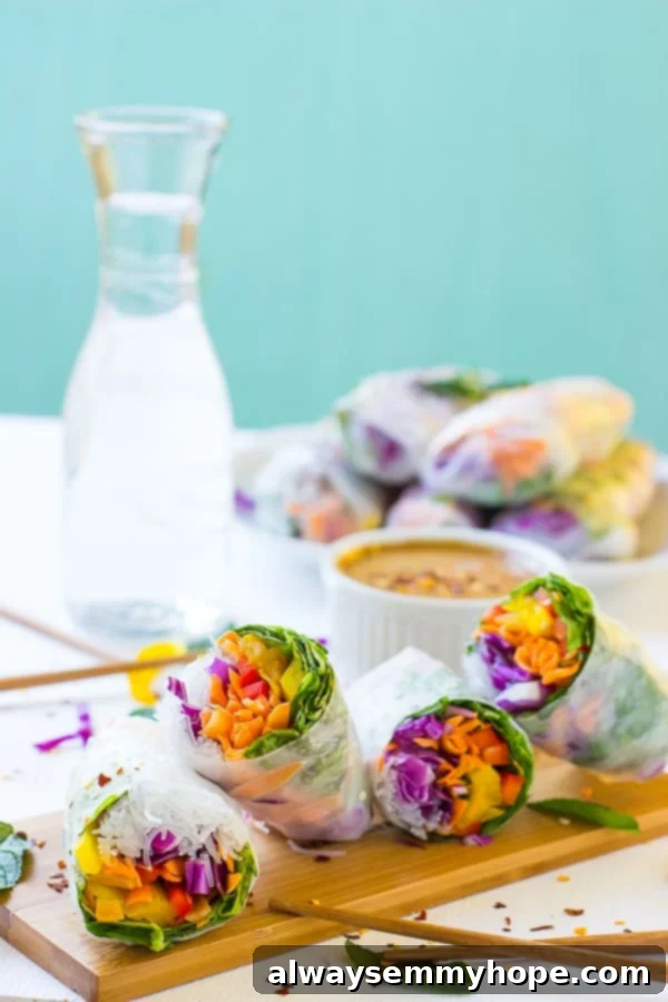 Fresh summer rolls arranged artistically on a wooden board, with a bowl of homemade peanut dipping sauce waiting in the background, inviting a delightful culinary experience.