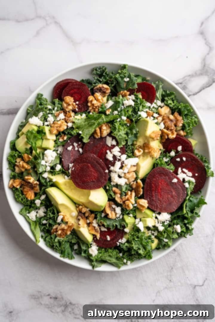 This beet feta salad pairs tender roasted beets and tangy vegan feta, along with a zippy maple mustard vinaigrette. Delicious and easy! Overhead view of beet feta salad in bowl before adding dressing