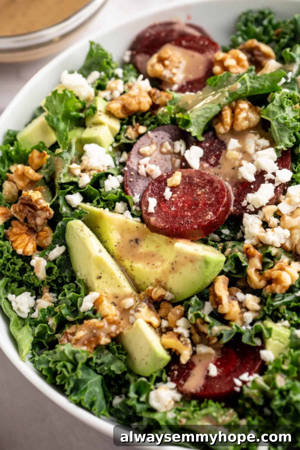 This beet feta salad pairs tender roasted beets and tangy vegan feta, along to a zippy maple mustard vinaigrette. Delicious and easy! Beet feta salad in bowl