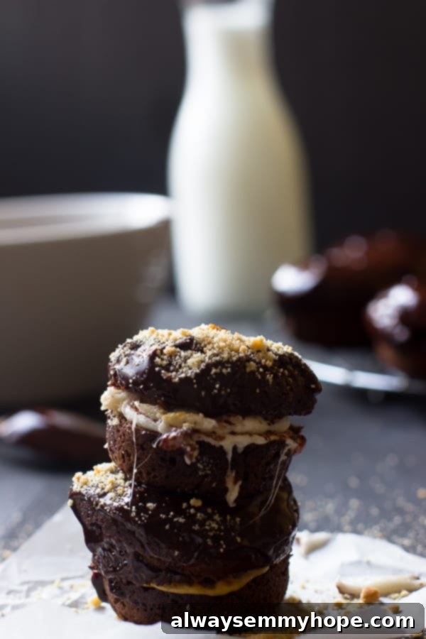 A stack of baked chocolate cake s'mores donuts, showcasing their rich chocolate color and fluffy texture.