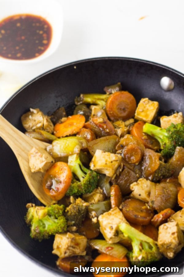 Tofu Stir fry in a black skillet.