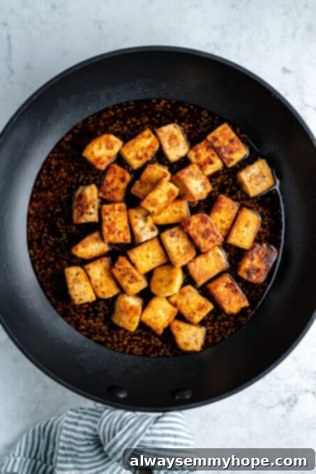 Crispy tofu cubes in teriyaki sauce.
