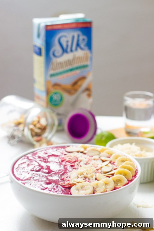 Side shot of a banana berry beet smoothie bowl.