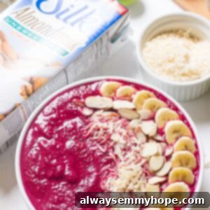 Overhead shot of banana berry beet smoothie bowl.