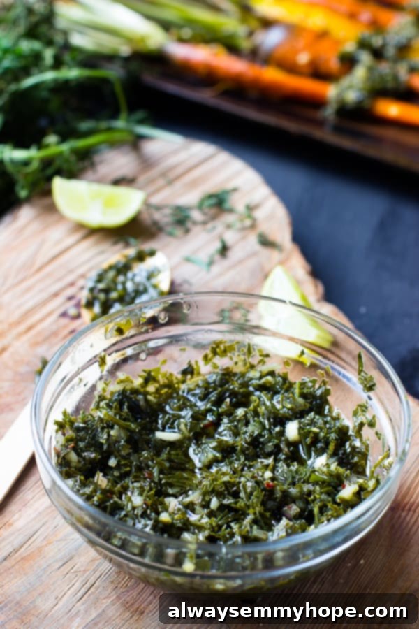 Sweet Maple Carrots with Zesty Greens Chimichurri 6 Close up of vibrant green chimichurri sauce in a clear glass bowl.