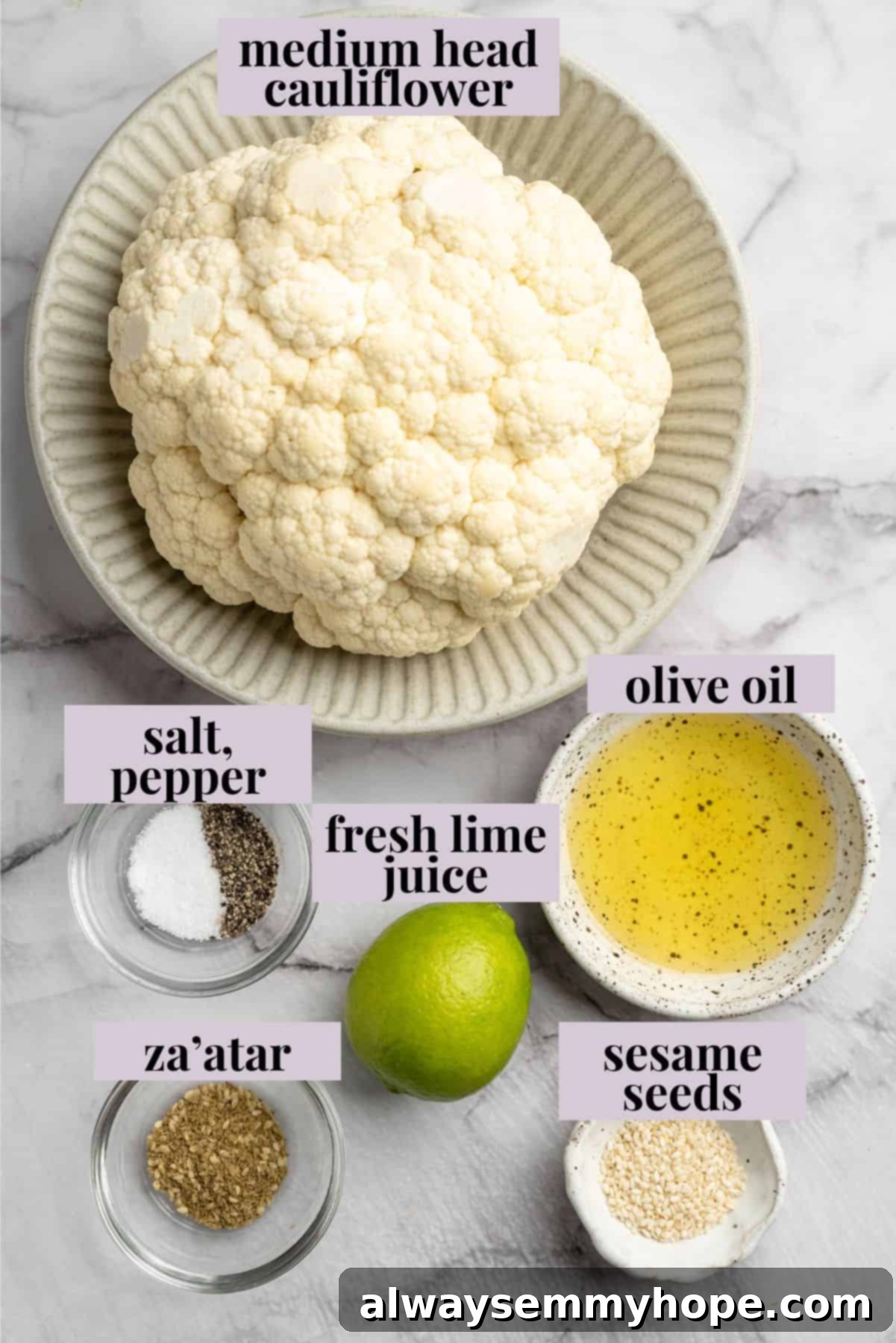 These easy roasted cauliflower steaks are tender, crispy on the edges, and incredibly flavourful thanks to the addition of za’atar! Overhead view of ingredients for cauliflower steaks with labels
