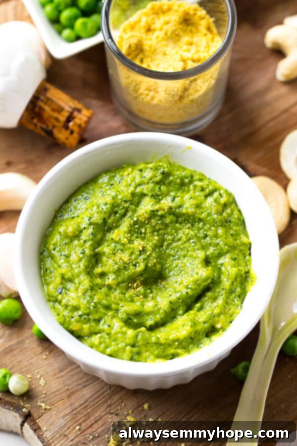 Overhead shot of cashew pea pesto in a white ramekin. 