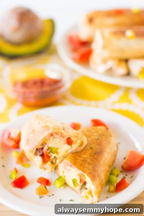Mexican breakfast burritos on a white plate.