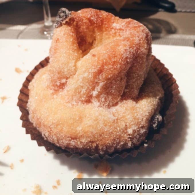 Unlocking Parisian Flavors 4 Close up of a pastry in a paper cup.