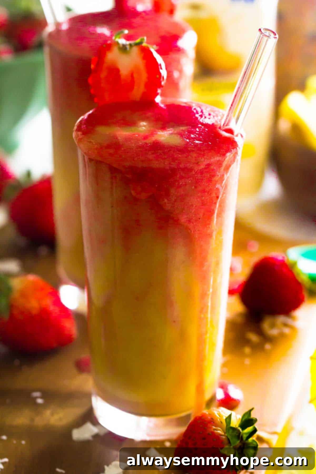 Layered Lava Flow Smoothies A close-up, side view of two perfectly layered Strawberry Pineapple Coconut Lava Flow Smoothies, elegantly presented in glasses on a rustic wooden surface, highlighting the distinct red and yellow colors blending beautifully.