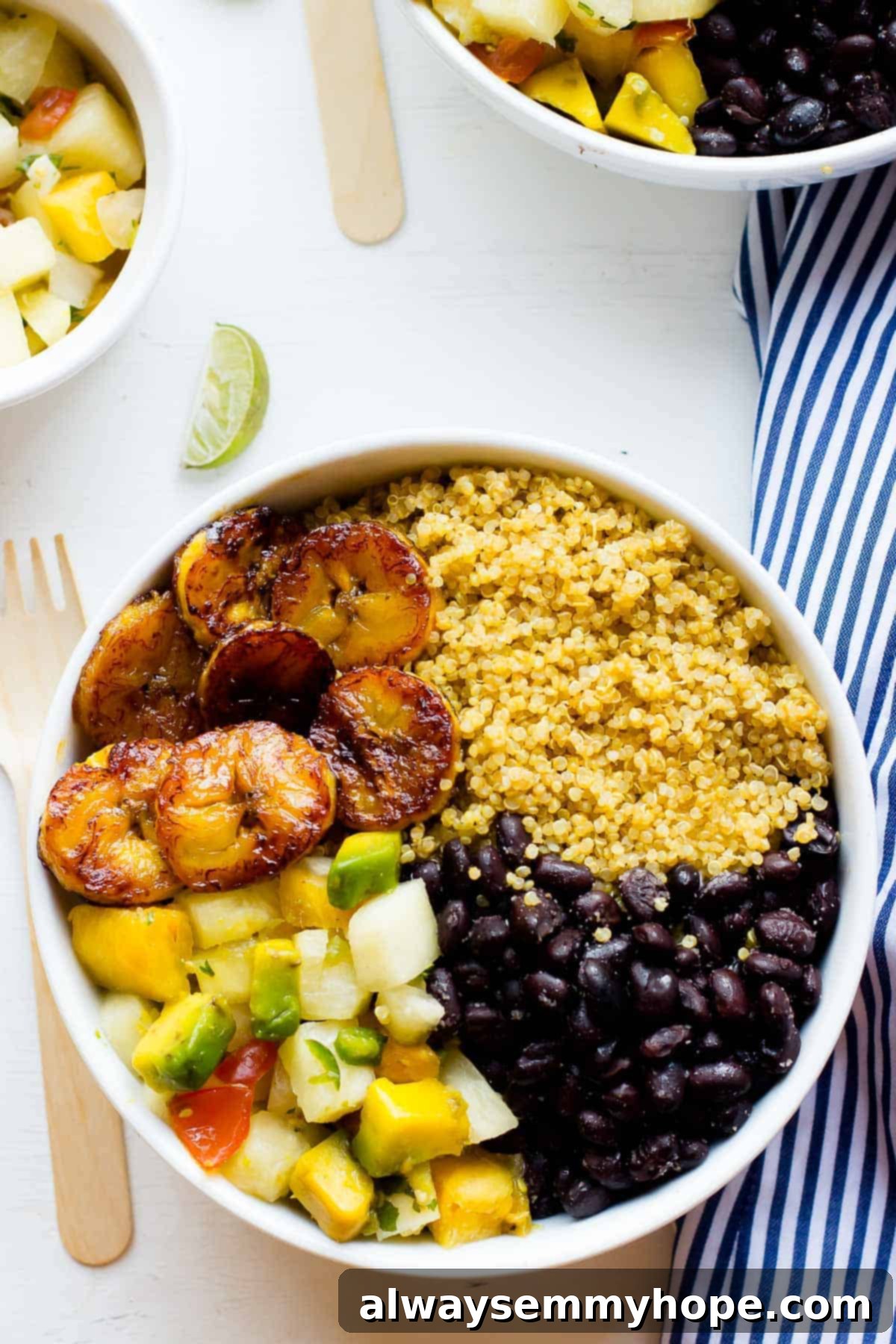Cuban Quinoa & Pineapple Salsa Bowls 2 Top down shot of cuban quinoa bowl on a white table.