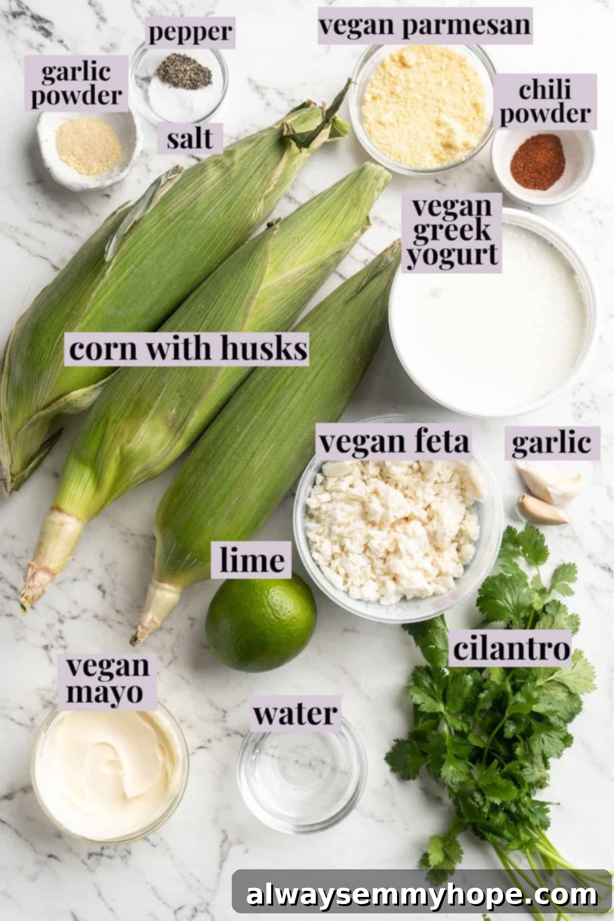 Fresh Ingredients for Homemade Vegan Elotes. Overhead view of fresh ingredients for Vegan Mexican Street Corn laid out on a white surface.