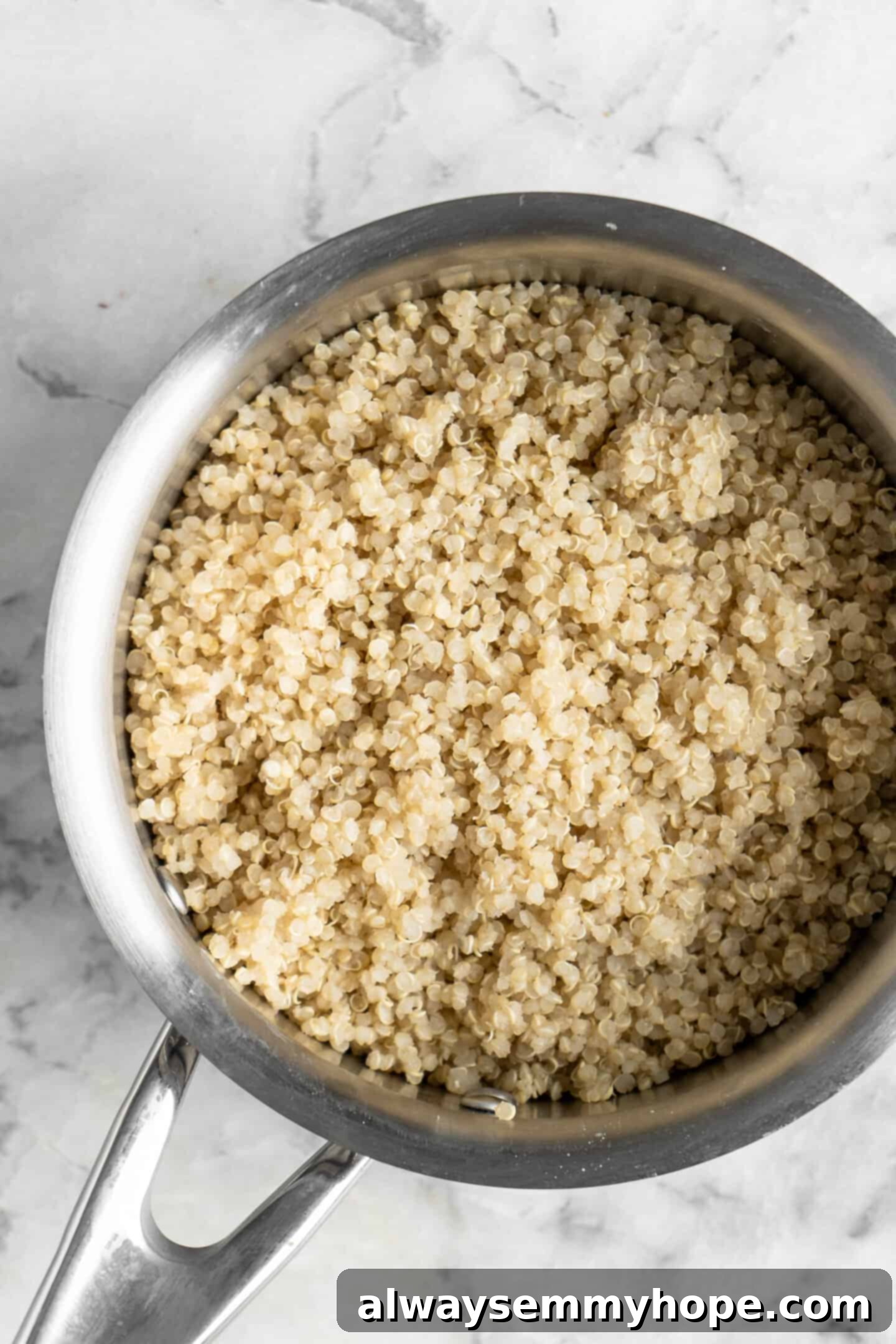 This easy Greek cucumber salad is loaded with filling veggies, topped with creamy hummus, and comes together in just 20 minutes! A small pot with cooked quinoa.