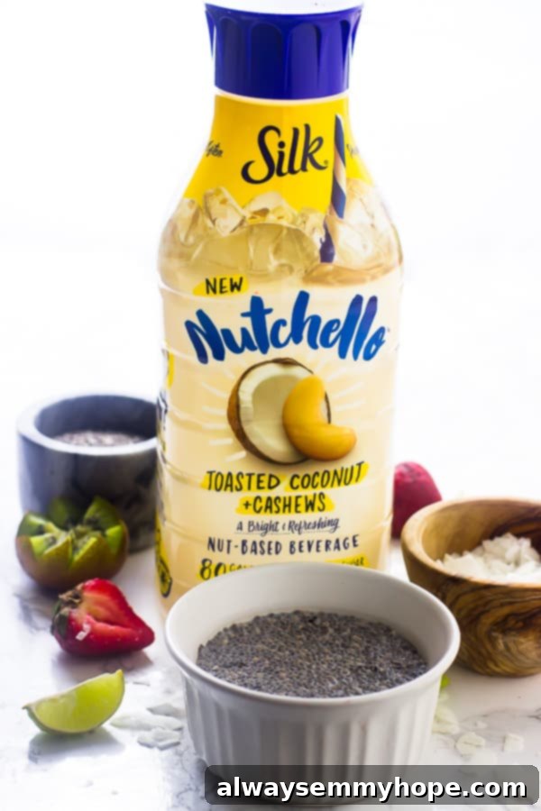 A bottle of nutchello nut milk on a table with chia seeds in a ramekin. 