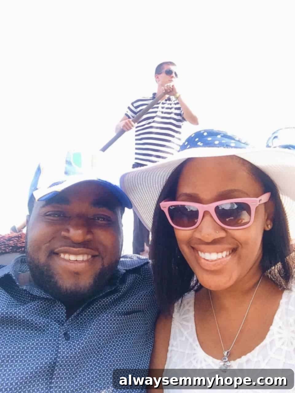 Glimpses of La Serenissima 4 A person enjoys a serene gondola ride, gliding gracefully through a historic Venetian canal, surrounded by charming buildings.