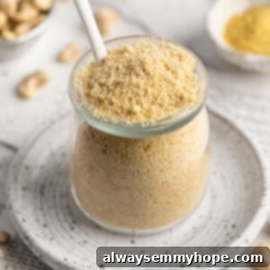 Jar of vegan Parmesan cheese with spoon