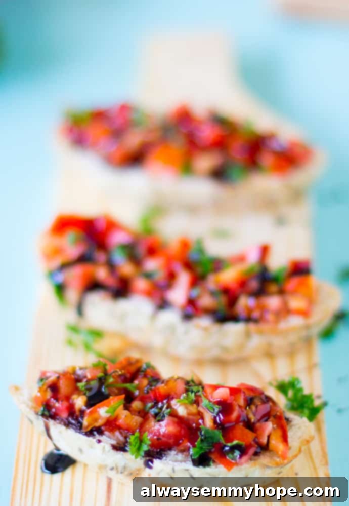 Bruschetta with balsamic glaze on a wood board.