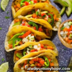 Terra's Kitchen: Sweet Potato Tacos Put to the Test 8 Top down shot of vegan tacos with wedges of lime.