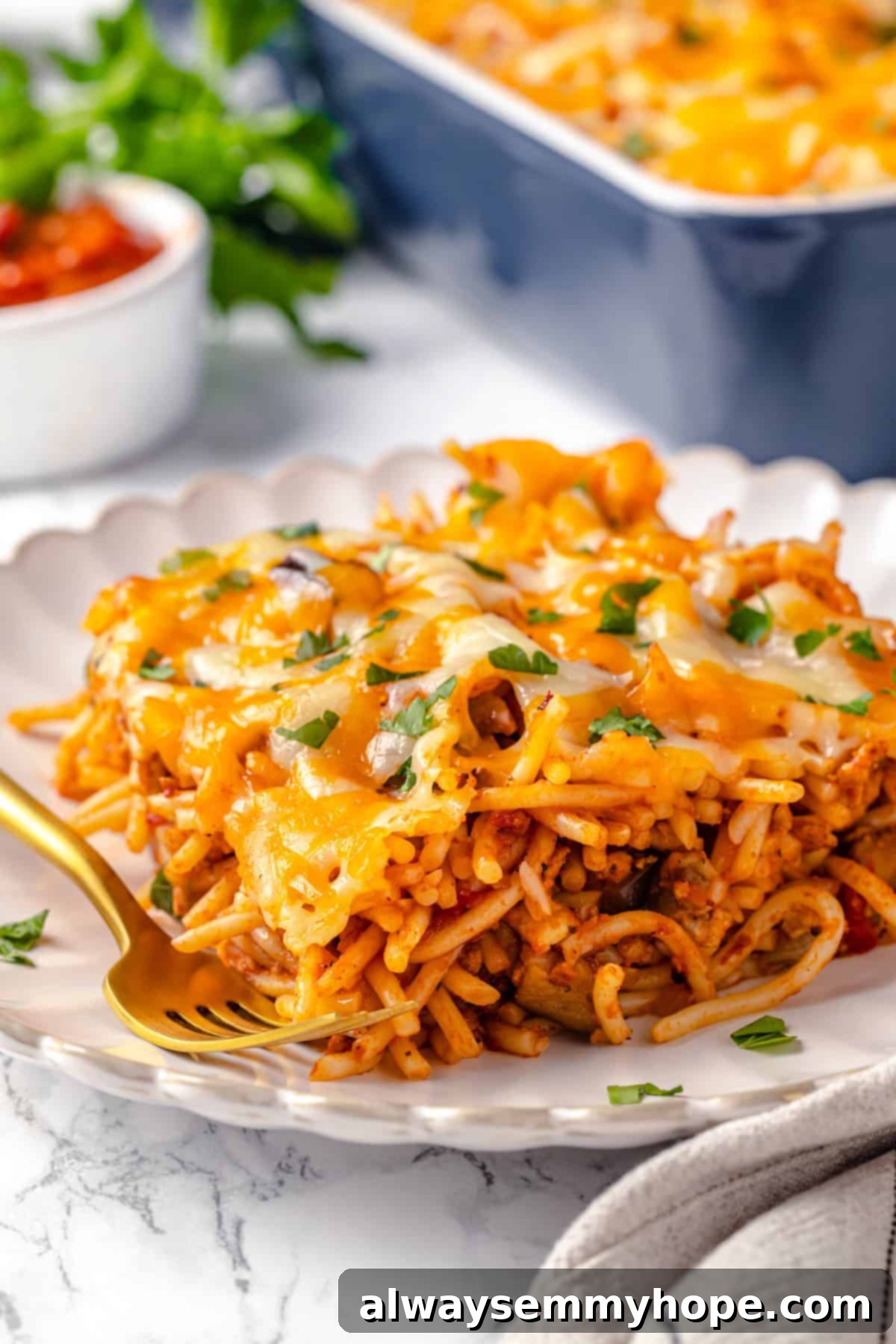 Vegan baked spaghetti on a plate with a fork
