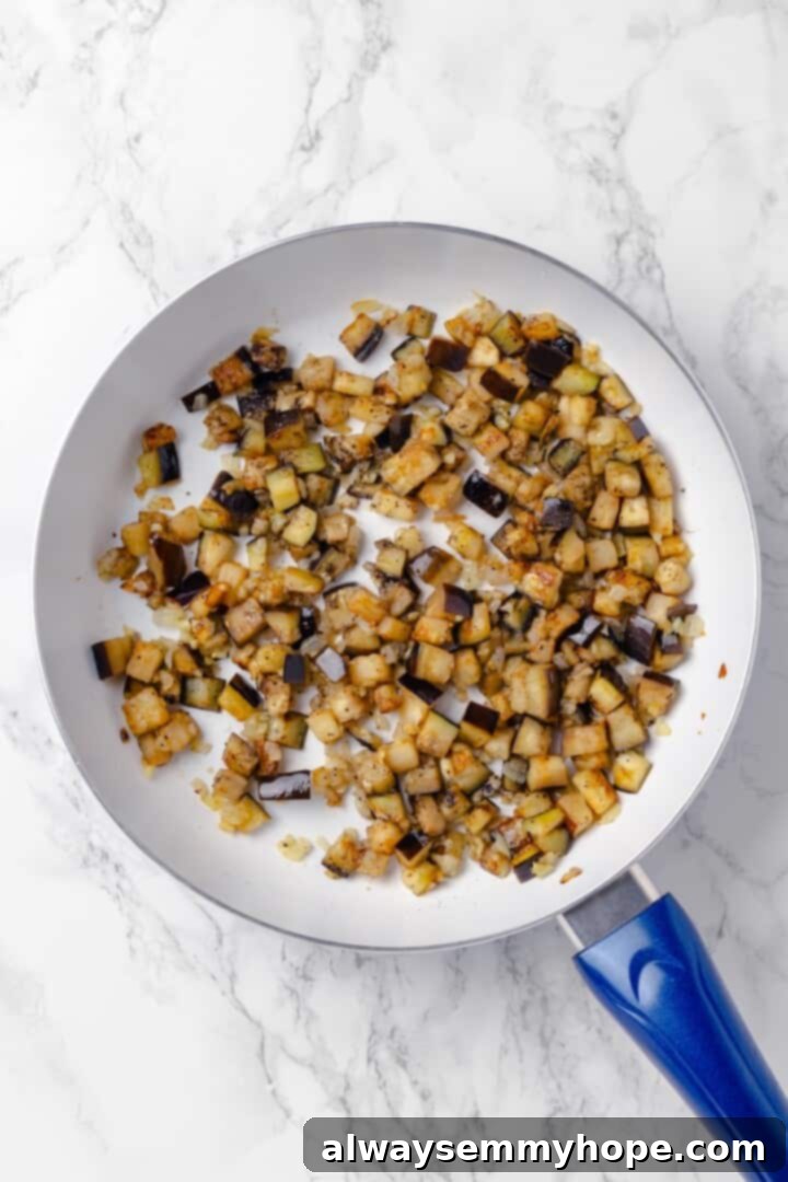Eggplant cooking in skillet
